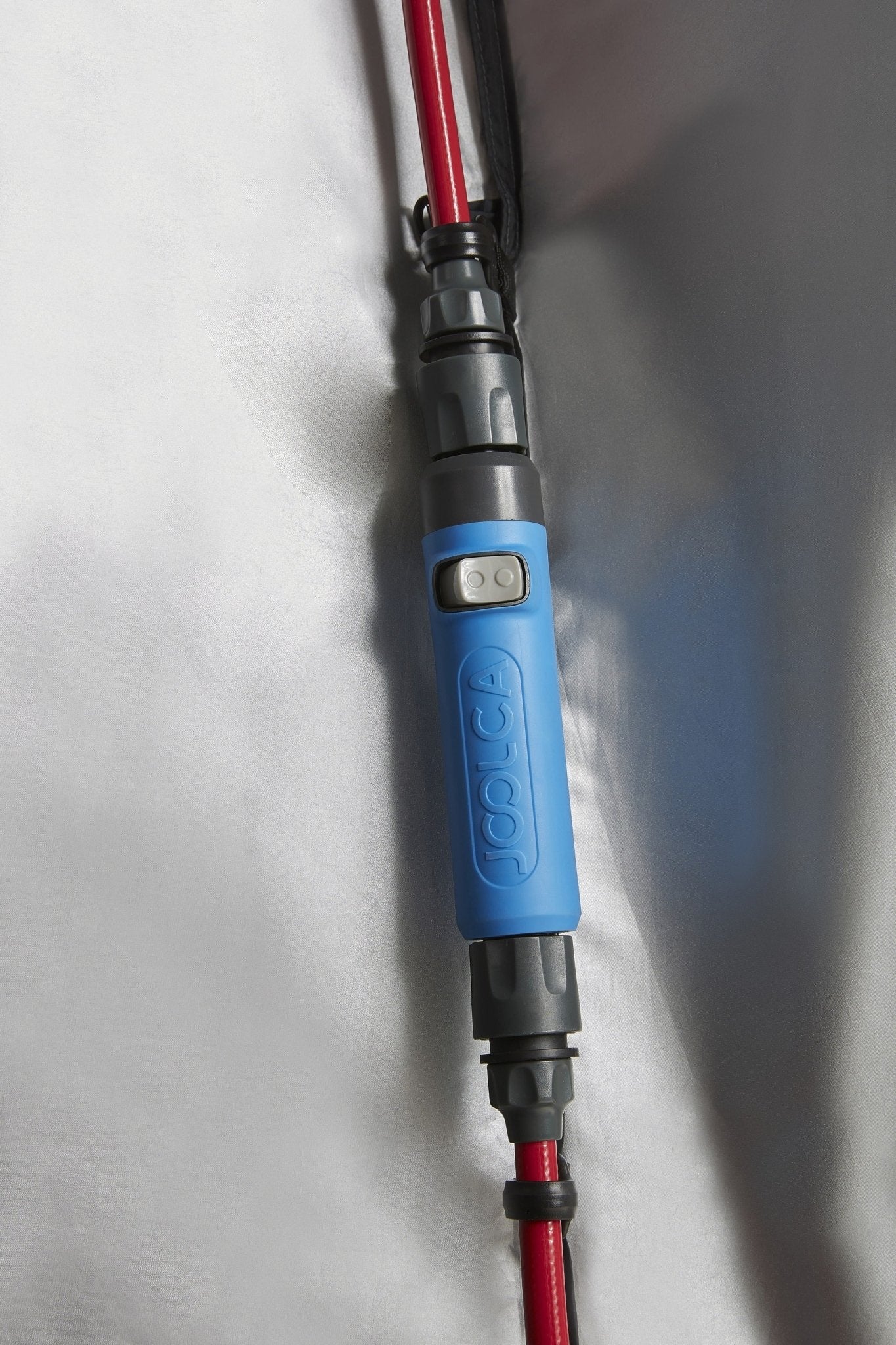 Hose clip inside the tent holding the shower hose