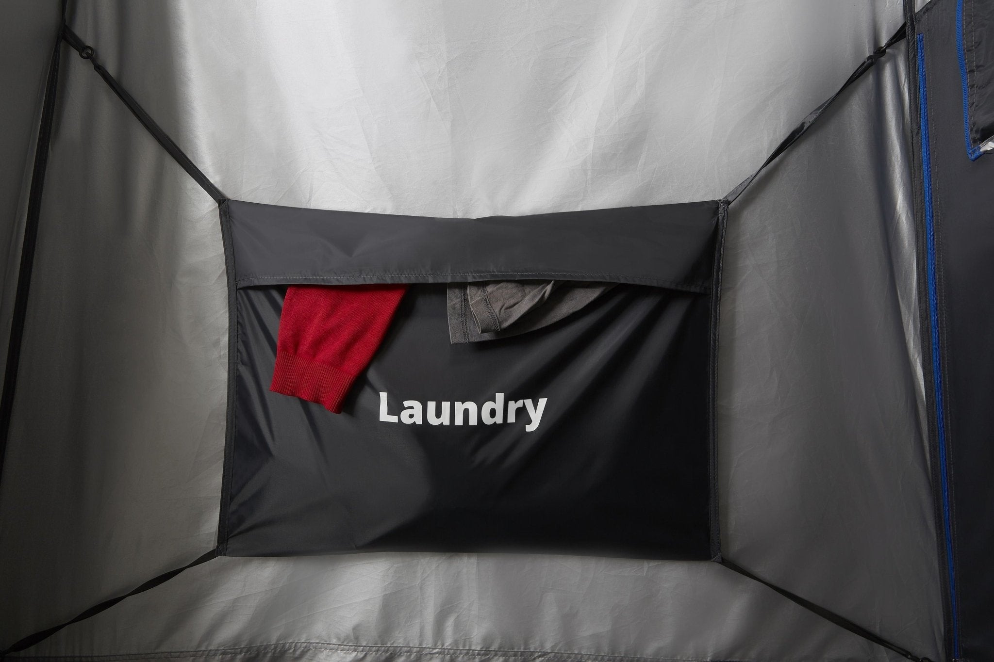 Laundry pocket inside the tent holding clothes