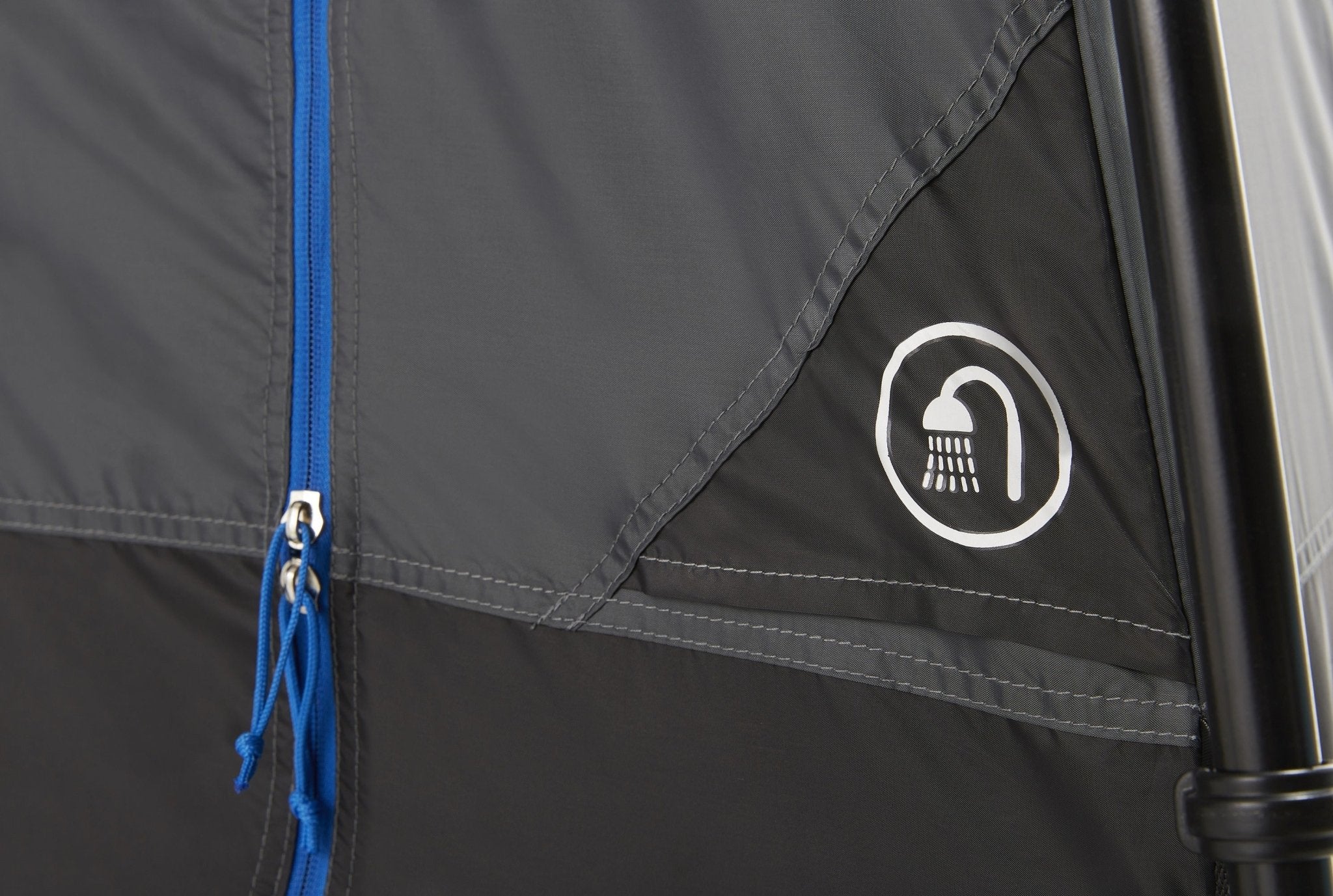 Shower symbol on the outside of the tent beside the blue zip