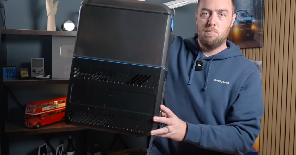 GottaGo portable toilet black unit displayed indoors by person